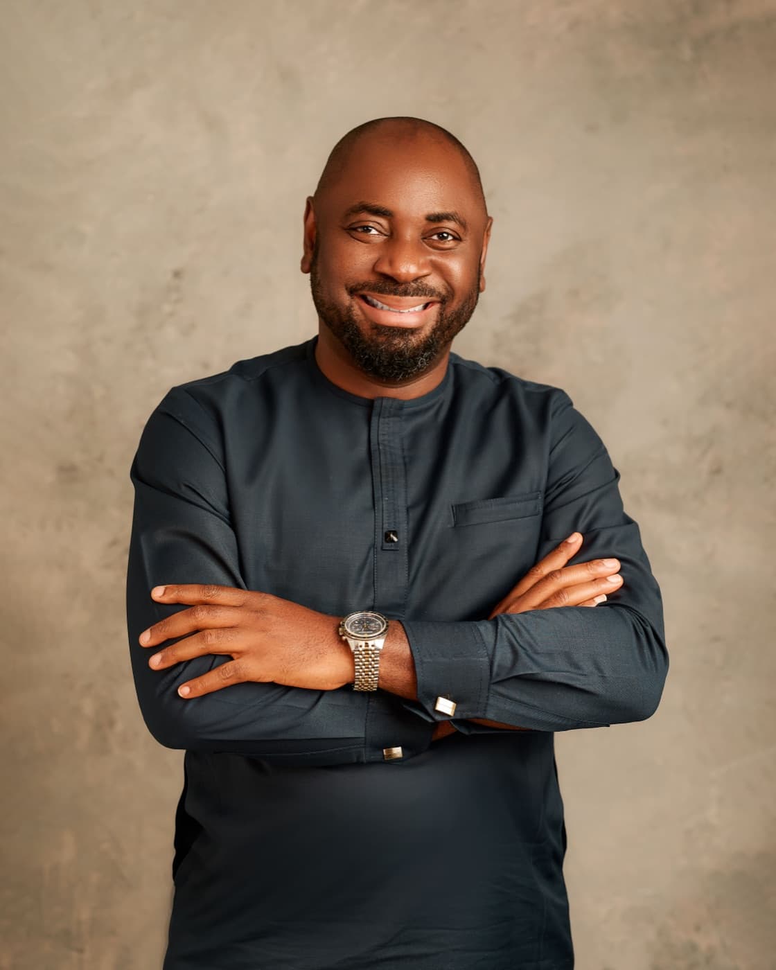 Apeh Harrison Iwodi, smiling portrait in traditional attire
