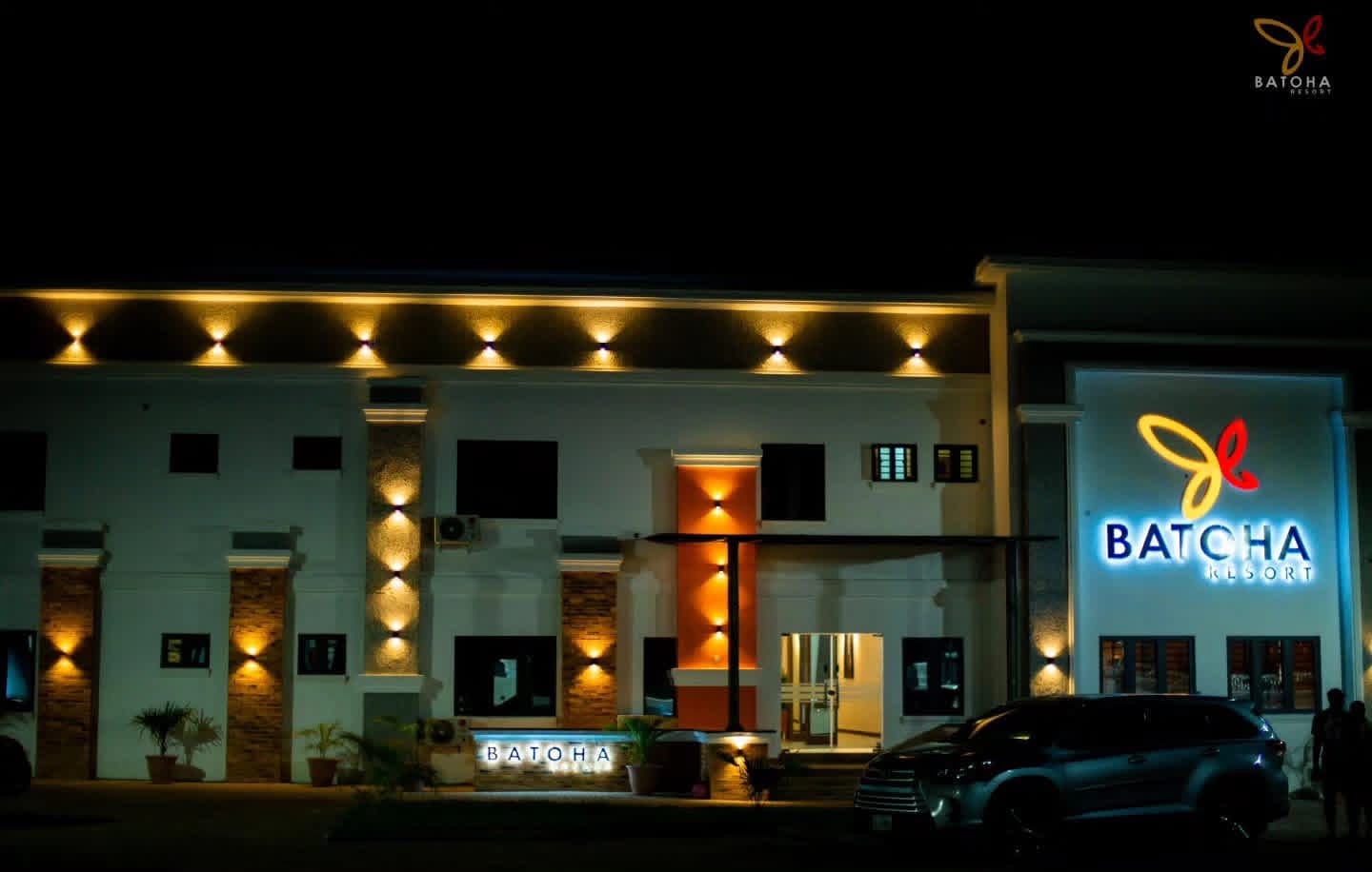 Batoha Resort building lit up at night with warm exterior lighting