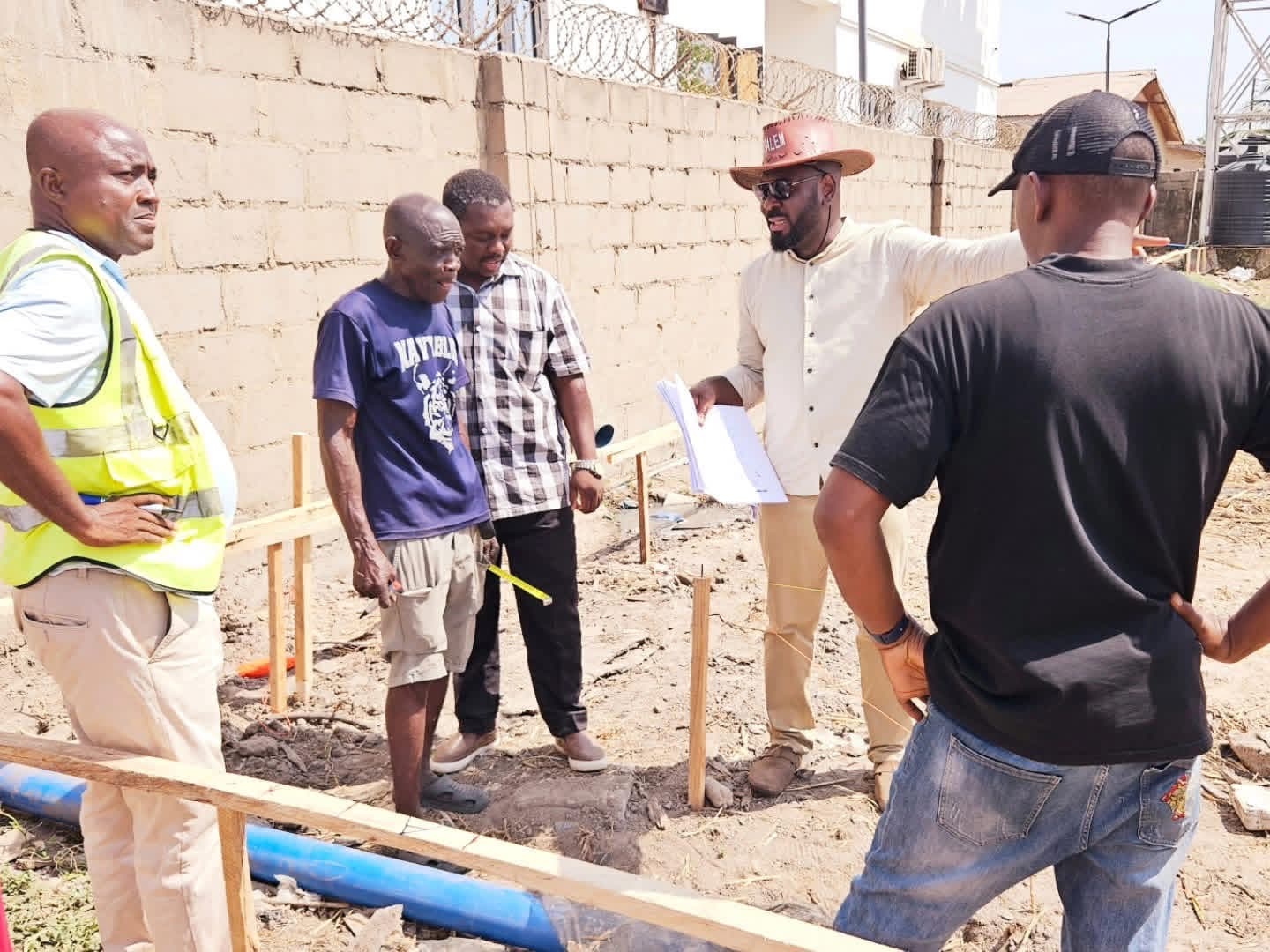 Group of men reviewing a plan on a construction site