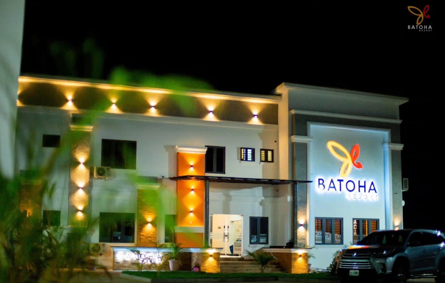 Batoha Resort building at night with its illuminated sign and entrance
